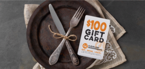 Rustic table setting with Cleveland Independents gift card in foreground